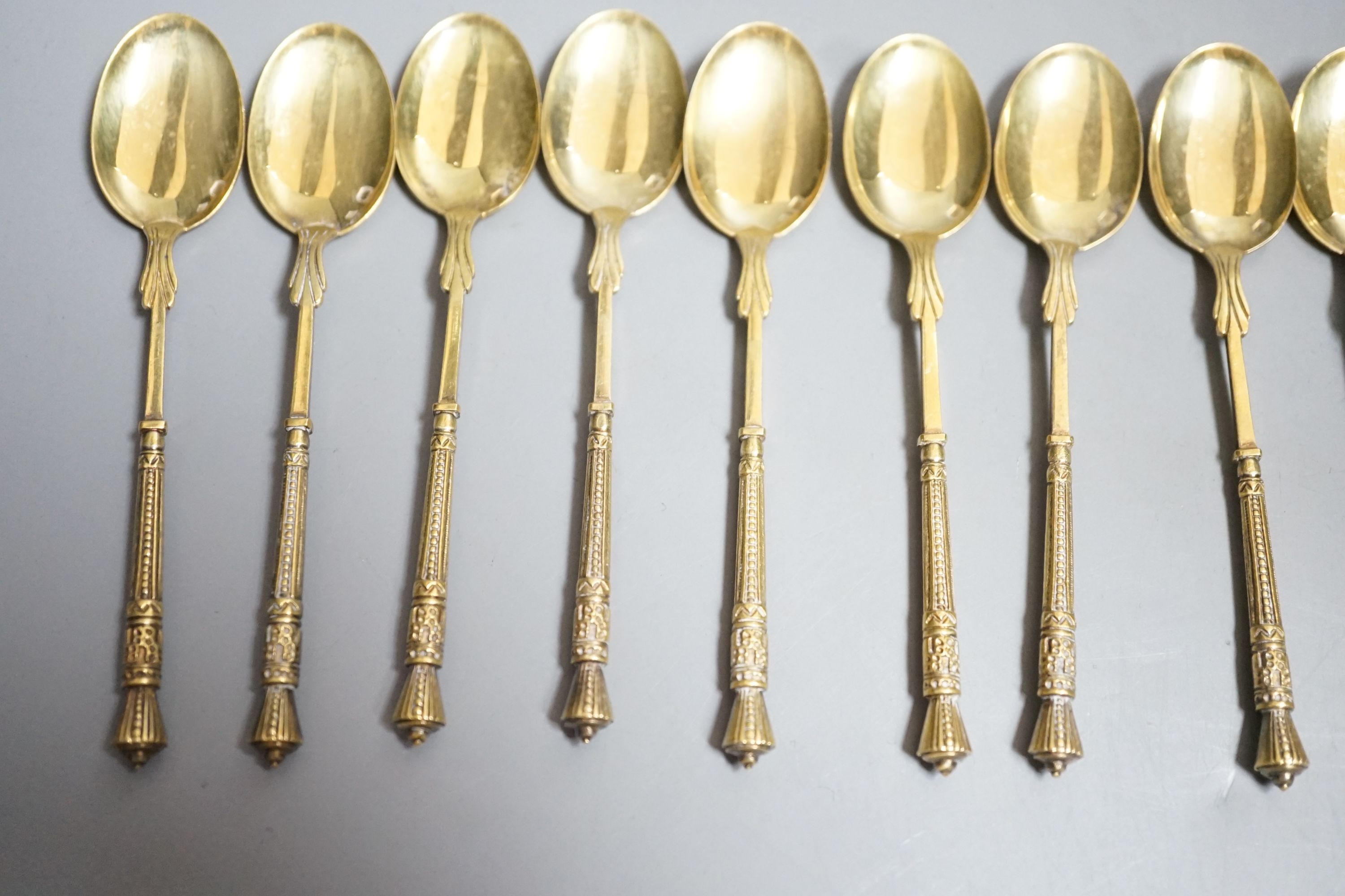 A set of twelve French 950 standard gilt white metal coffee spoons, 11cm, 5.2oz.